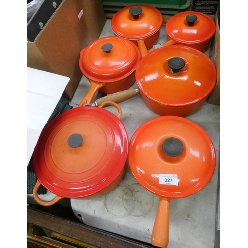 327 - Five assorted sized Le Creuset orange saucepans all with lids and a casserole dish with lid