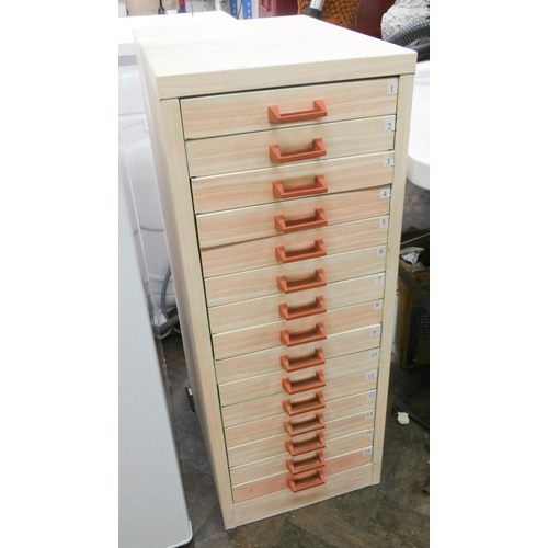 333 - A fifteen drawer metal filing cabinet, has been covered