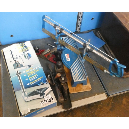 396 - An upright drill stand, two old planes, mitre saw, old sewing machine etc