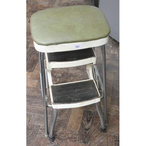 404 - A green leather topped stool with fold away steps