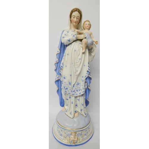 120 - A large late 19th century continental porcelain figure of Madonna and child, standing 52cms tall