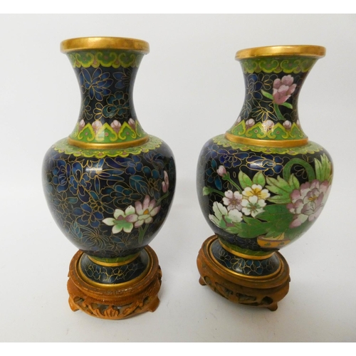 517 - A pair of Chinese blue ground cloisonné vases on stands, measuring 18cms including stand