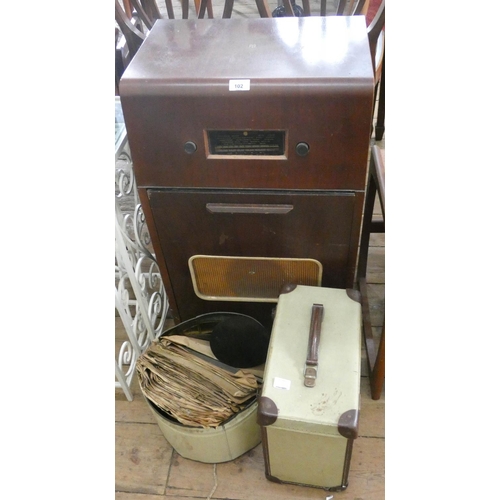 102 - An old PYE cabinet radiogram and a quantity of assorted records