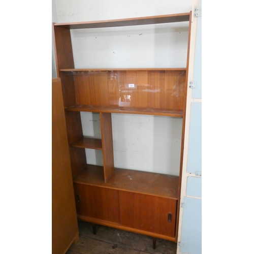 123 - A 1970's teak bookcase with sliding doors under, 3' wide