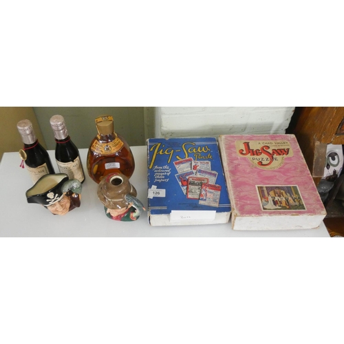 126 - Two old wooden jigsaw puzzles, bottle of Dimple Whisky, two bottles of Harleys Ale and two small Dou... 