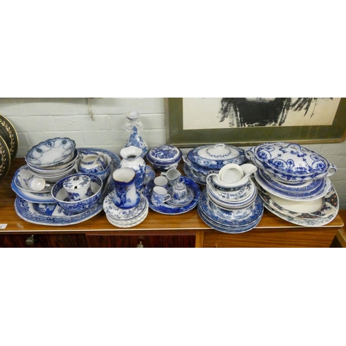 16 - A large quantity of assorted blue and white china including willow pattern