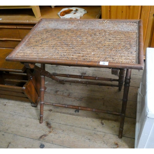 36 - A simulated bamboo folding supper table with cane top