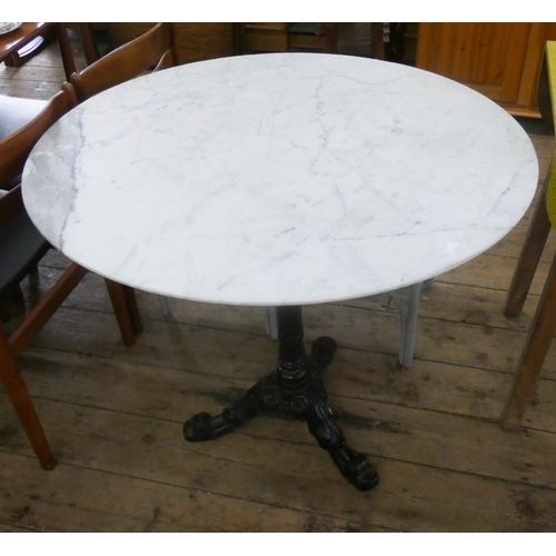 74 - A circular Victorian style garden or pub table on black iron base with white marble top, 3' diameter