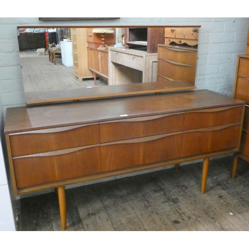 86 - A 1970's Austinsuite teak dressing table fitted six drawers with long mirror, 4'9 wide