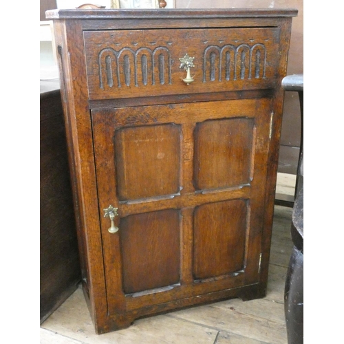 93 - A floor standing oak corner cupboard fitted drawer