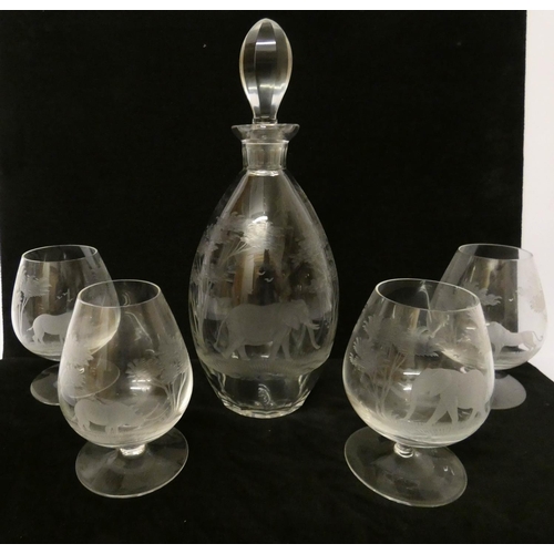 540 - A Rowland Ward cut and engraved decanter and a set of four brandy balloons all engraved with African... 