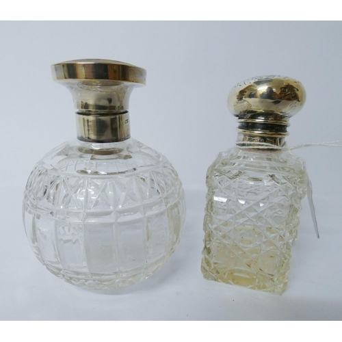 604 - Two cut glass and silver mounted scent bottles with hinged lids