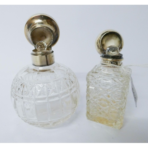 604 - Two cut glass and silver mounted scent bottles with hinged lids