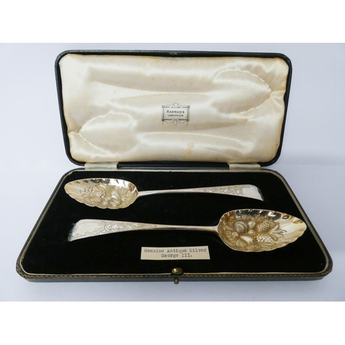 607 - A pair of George III silver berry spoons in Harrods fitted box