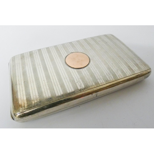 610 - A hallmarked silver engine turned double cigarette box with inset gold panel to the lid, gross weigh... 