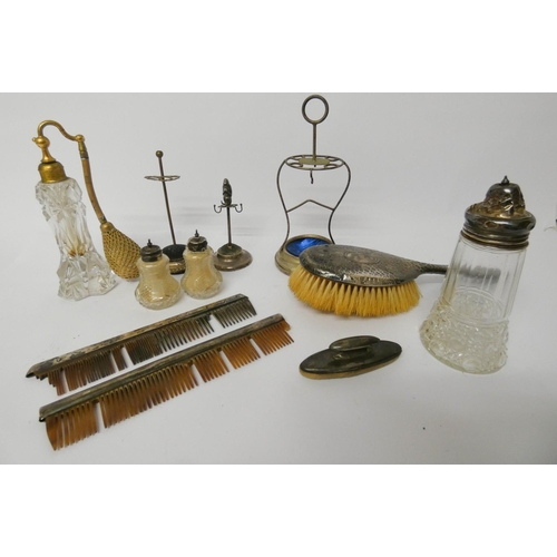 614 - A collection of dressing table items to include silver backed hairbrush, nail buffer, cut glass atom... 