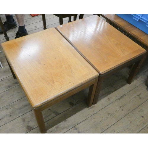 130 - A pair of matching teak coffee tables