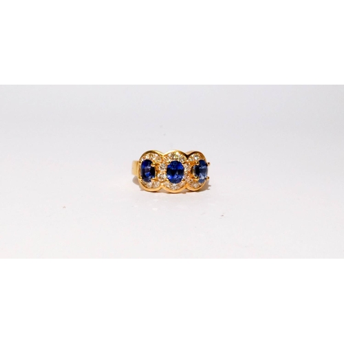 675 - A quality modern sapphire and diamond triple cluster ring, of three large oval sapphires of good col... 