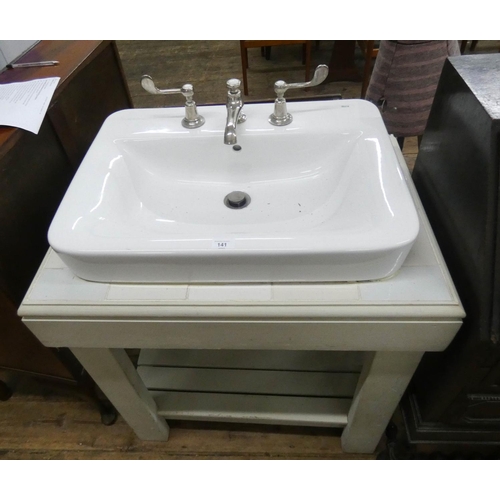 141 - A two tier white vanity sink unit with ceramic basin and Lefroy Brooks quality taps