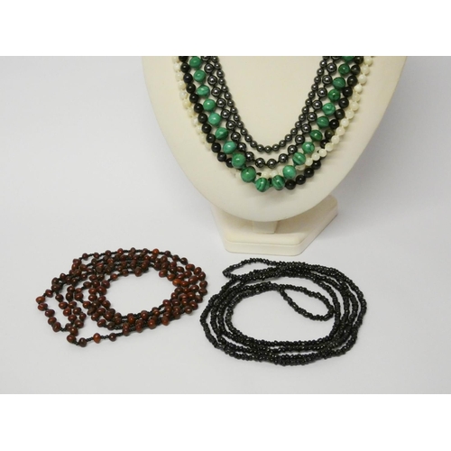 599 - Several strings of beads - malachite, haematite, tigers eye etc