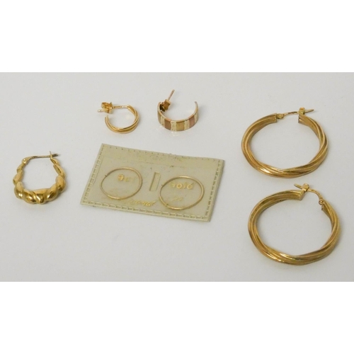 636 - A pair of 9ct yellow gold hoop earrings and other 9ct gold earrings, gross weight 5.5 grams