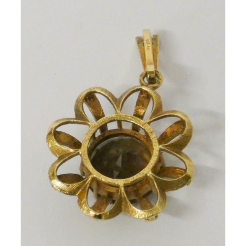 648 - A smoky quartz set flower design 9ct gold pendant