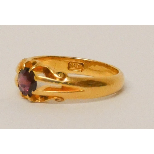 673 - Victorian 18ct yellow gold signet style ring claw set with a garnet, marked 18ct to shank. Ring size... 