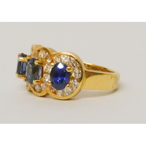 675 - A quality modern sapphire and diamond triple cluster ring, of three large oval sapphires of good col... 