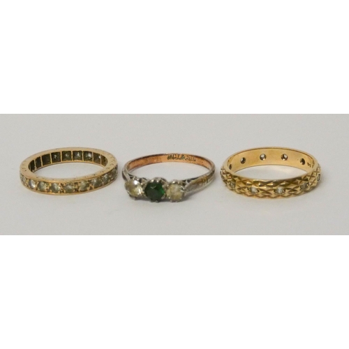 687 - 9ct gold stone set eternity ring, 9ct gold and silver mounted green stone ring and a further eternit... 