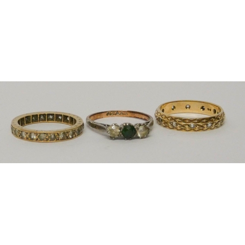 687 - 9ct gold stone set eternity ring, 9ct gold and silver mounted green stone ring and a further eternit... 