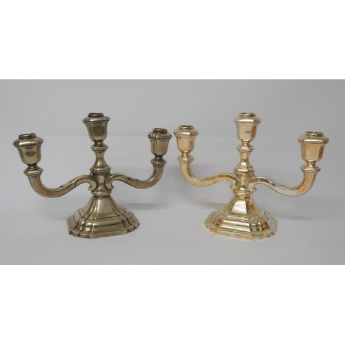 620 - Pair of German silver 800 standard three branch candelabra, on shaped square bases. Hollow cast. Hei... 