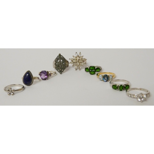 575 - A collection of nine silver ladies dress rings set various stones.