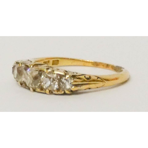 581 - Victorian 18ct gold five stone diamond half hoop ring in carved setting. Ring size O