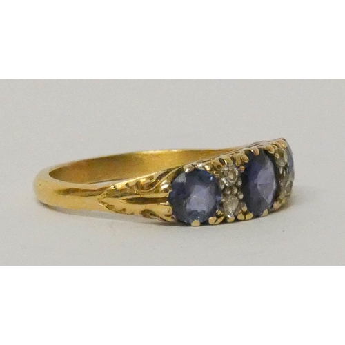 588 - Victorian sapphire and diamond half hoop ring, set with three oval sapphires on a carved setting. Ri... 