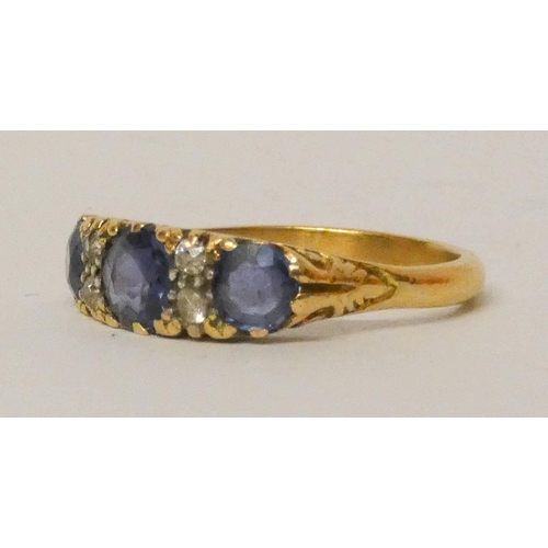 588 - Victorian sapphire and diamond half hoop ring, set with three oval sapphires on a carved setting. Ri... 