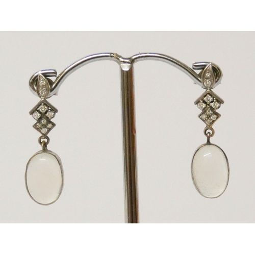 594 - A pair of vintage moonstone and diamond set drop earrings with post fittings.