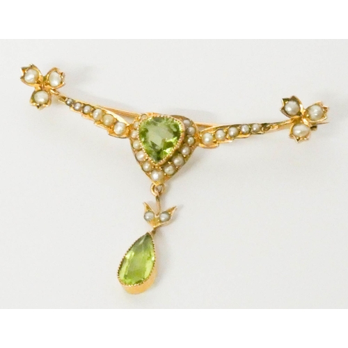 642 - Edwardian peridot and pearl bar brooch, the central heart shaped cluster with dropper pendant beneat... 