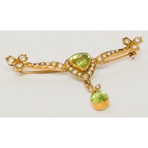 642 - Edwardian peridot and pearl bar brooch, the central heart shaped cluster with dropper pendant beneat... 