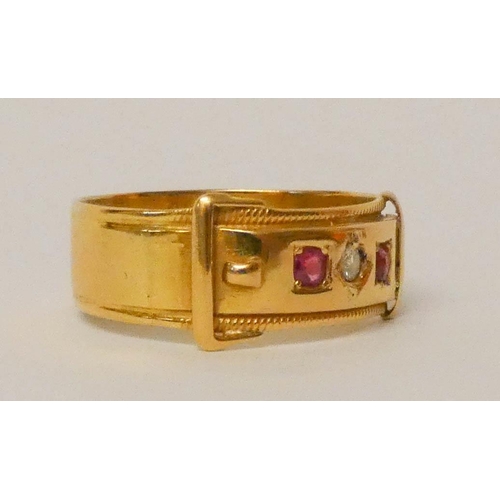 656 - Victorian buckle design ring set with rubies and a diamond, yellow metal un-hallmarked but tests as ... 