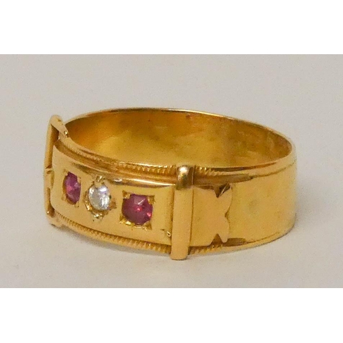 656 - Victorian buckle design ring set with rubies and a diamond, yellow metal un-hallmarked but tests as ... 