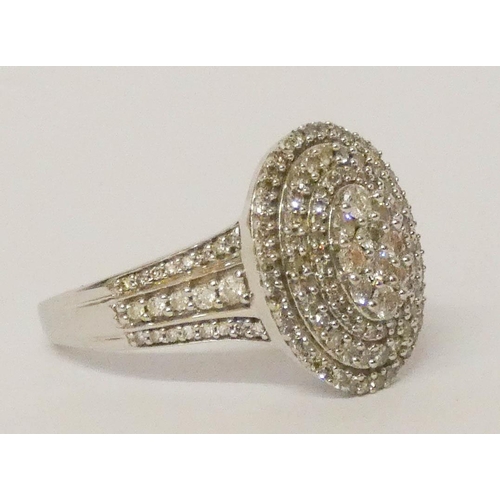 678 - A large oval diamond cluster panel ring, in 18ct white gold on diamond shoulders, ring size S