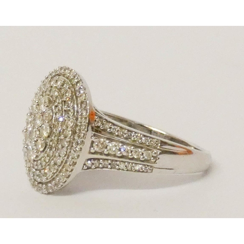 678 - A large oval diamond cluster panel ring, in 18ct white gold on diamond shoulders, ring size S