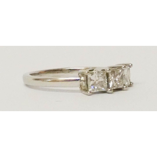 684 - A three stone diamond trilogy ring, set three princess cut diamonds, on a white gold band. Size M