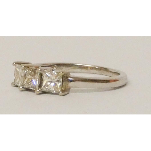 684 - A three stone diamond trilogy ring, set three princess cut diamonds, on a white gold band. Size M