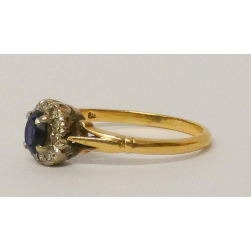 686 - An oval sapphire and diamond cluster ring, on 18ct yellow gold band. Ring size N