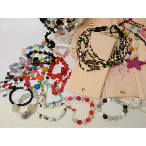 565 - A quantity of modern costume jewellery to include pieces by Lola Rose with velveteen pouches.