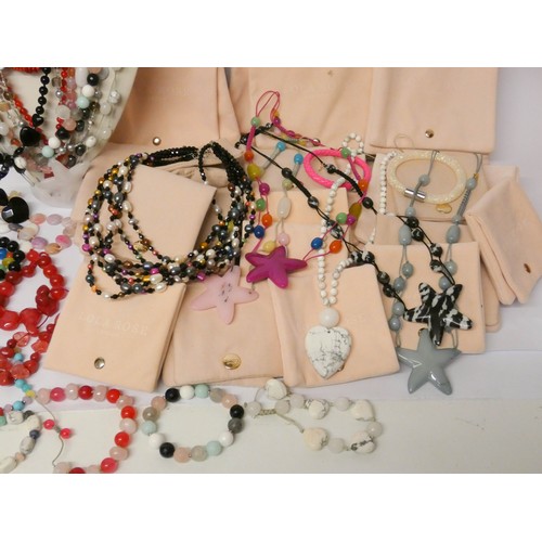 565 - A quantity of modern costume jewellery to include pieces by Lola Rose with velveteen pouches.