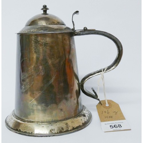 568 - A silver lidded tankard, of straight sided tapering form, the domed hinged cover with scrolled handl... 