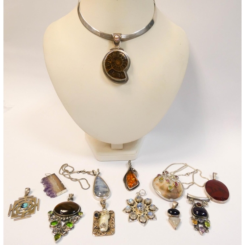 654 - A silver torque choker and twelve modern silver statement pendants set semi precious stones, amber a... 