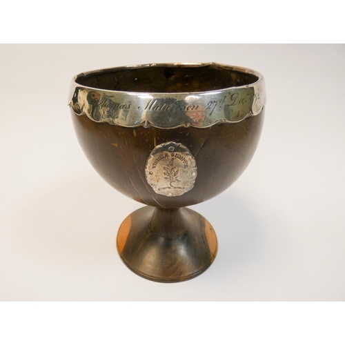 450 - An 18th century coconut cup, with silver rim and mount, inscribed Thomas Mathieson 27th December 179... 